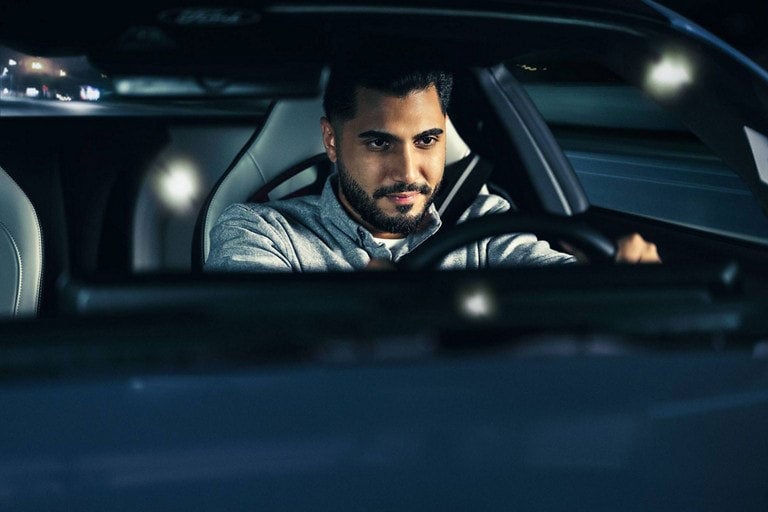 Person sitting in the driver’s seat of a parked 2024 Ford Mustang® coupe | Elmer Hare Ford Sales, Inc. in Marshall MO